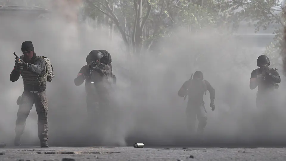 WARDOGS infantry squad advancing through smoke during a battlefield deployment